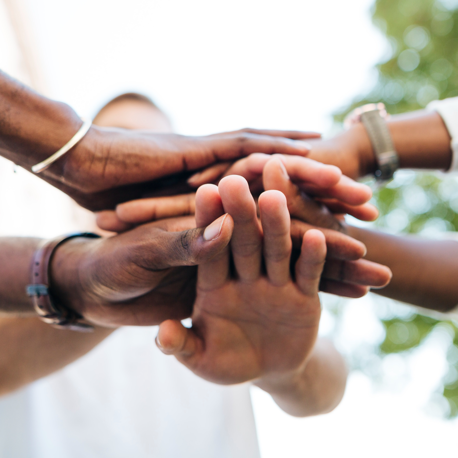 Hands coming together in unity